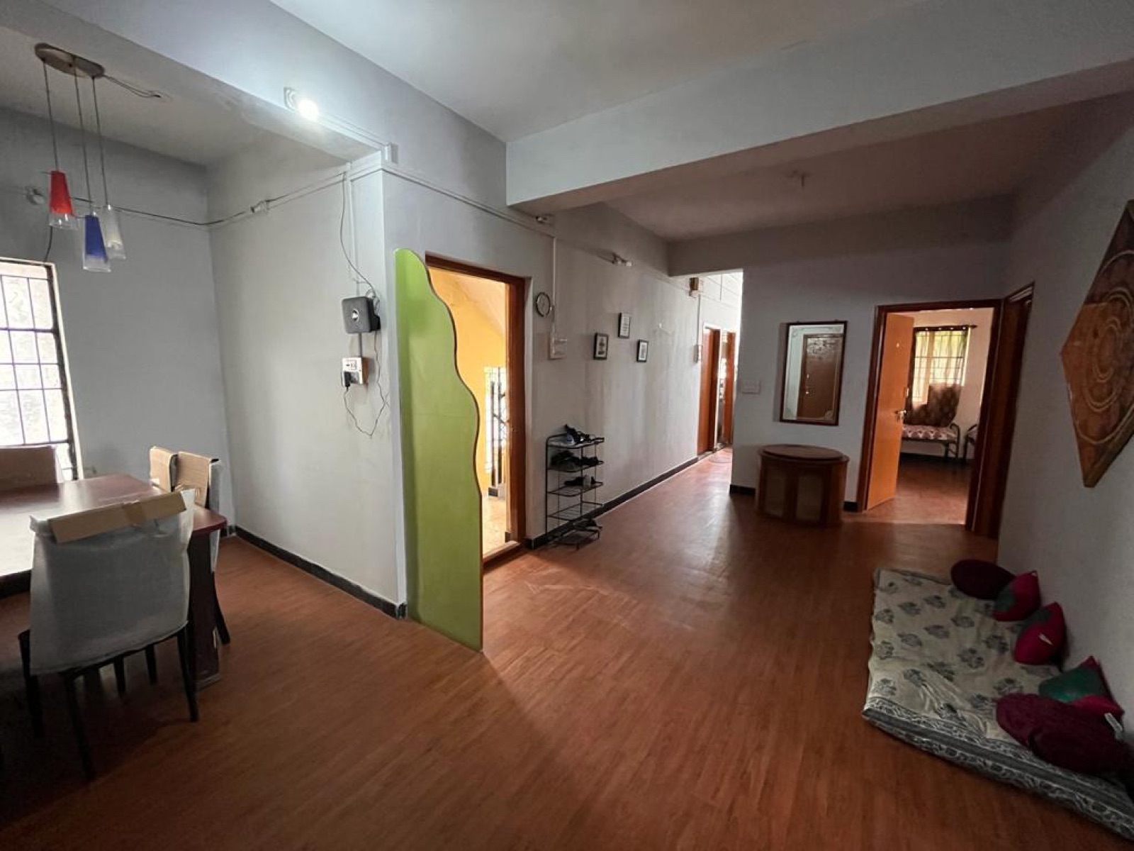 Bright, spacious common hall and dining area at Avadhut PG